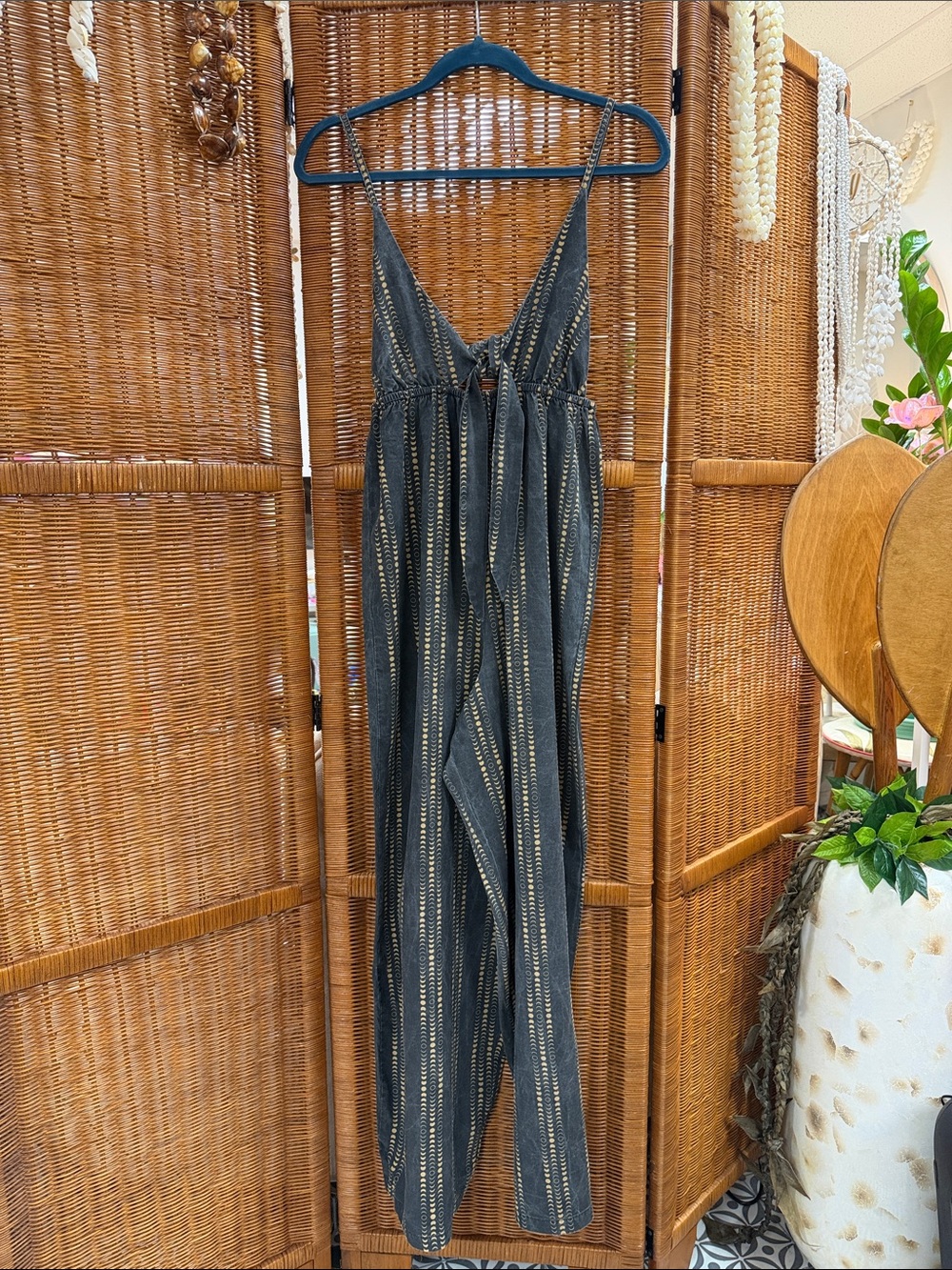 Lei Kini’s Black Striped V-Neck Jumpsuit with Tie Front